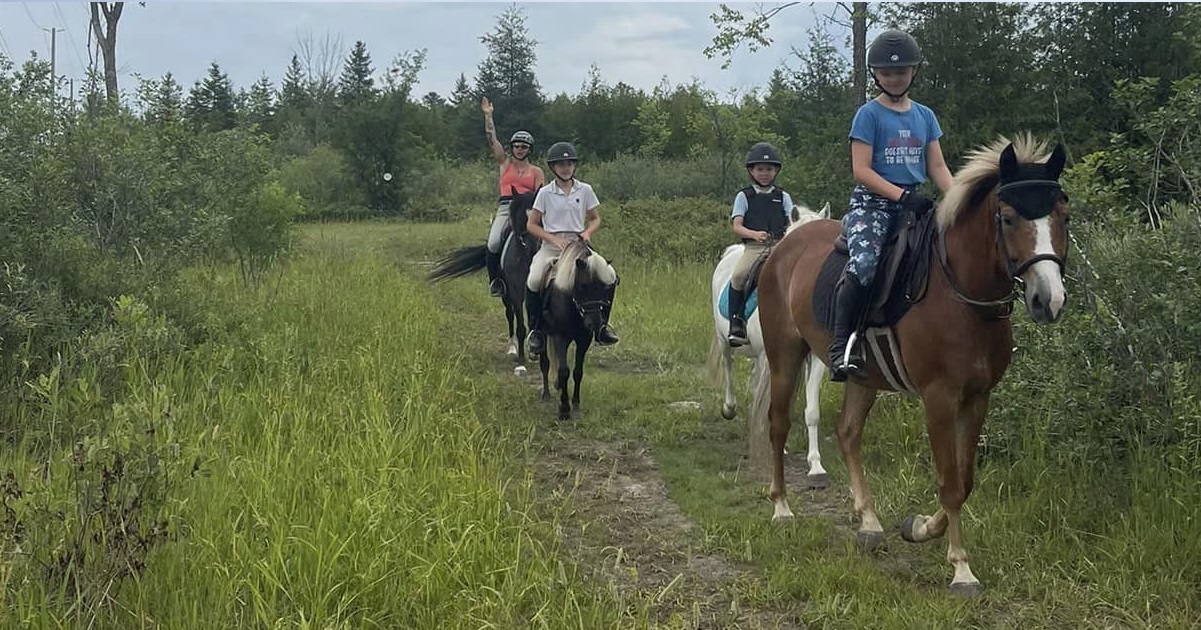 Team with rider waving